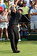 Leader Phil Mickelson teeing off on the 18th h...